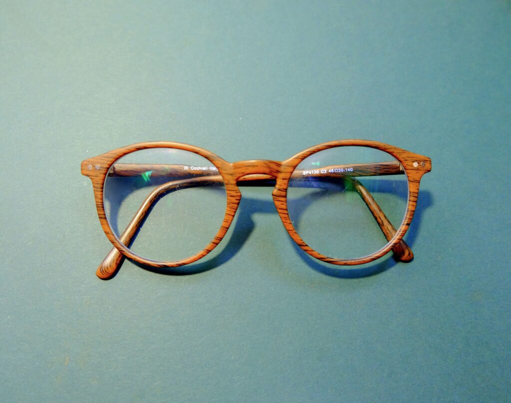 deisgner eye glass frames on blue background